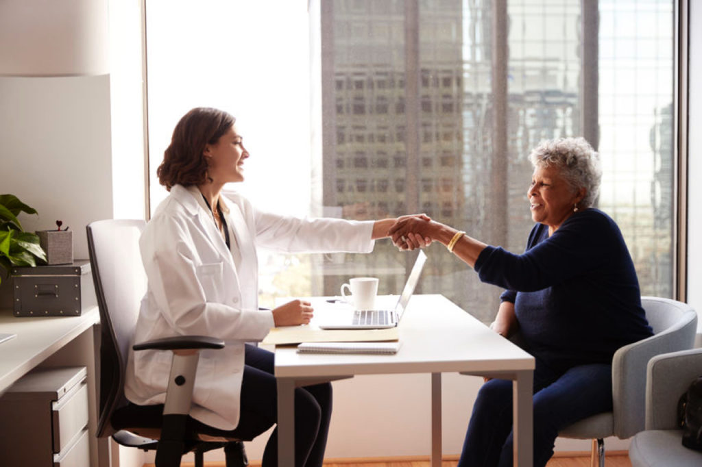 Doctor and patient shaking hands