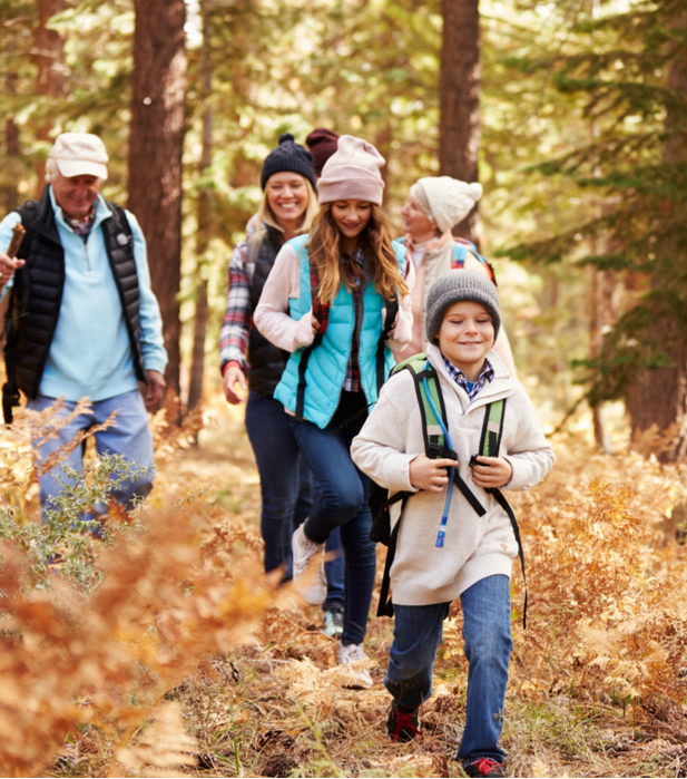 Happy family hiking in the woods