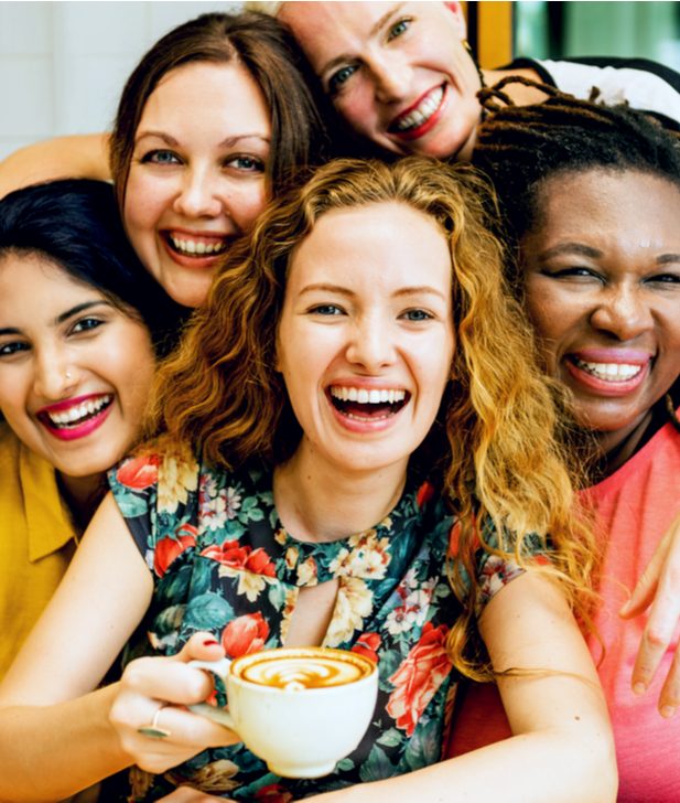 group of happy women enjoying coffee