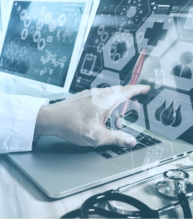 Healthcare provider pointing at a laptop Healthcare provider pointing at a laptop